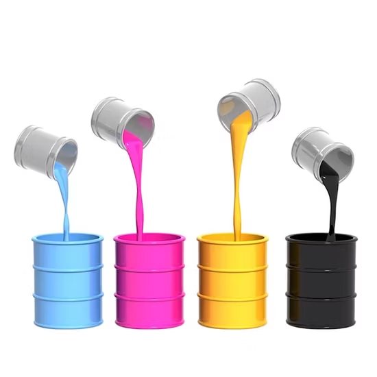 Cyan, magenta, yellow and black ink pouring into drums