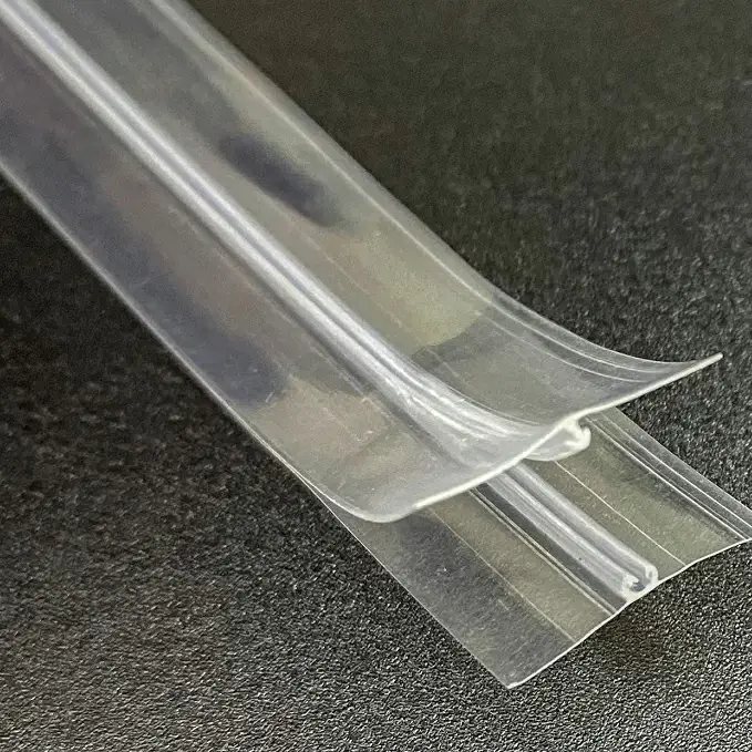 Close-up of a clear press-to-close zipper profile